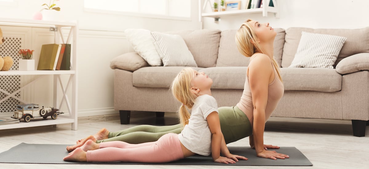 mother daughter yoga in living room